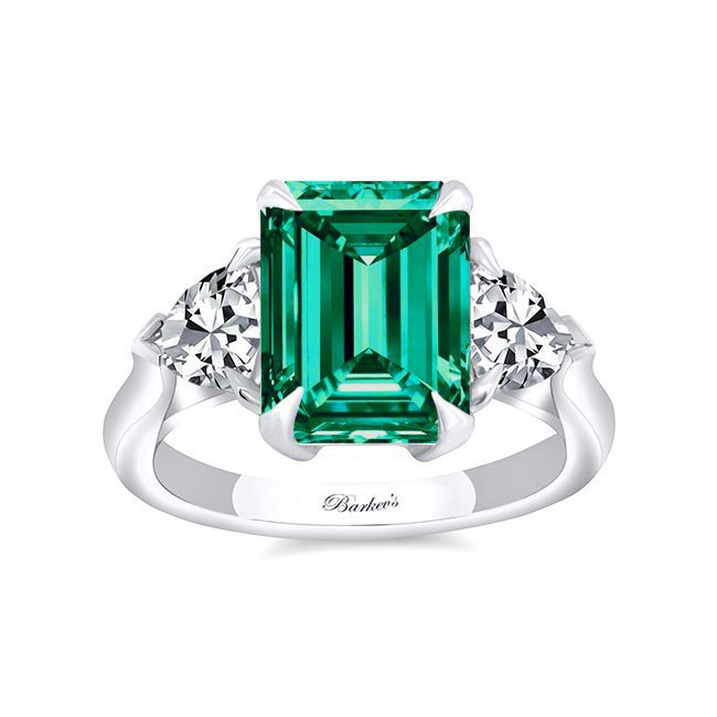 Emerald and asscher cut diamond bespoke engagement rings
