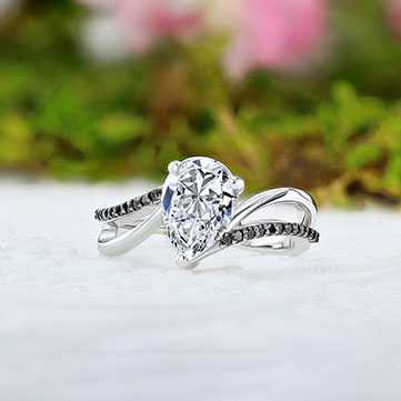 Black diamond engagement ring outdoors