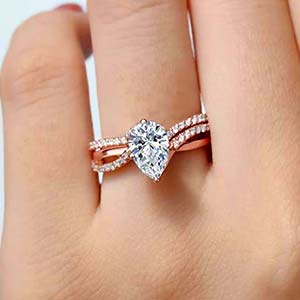 Woman wearing a rose gold diamond engagement ring